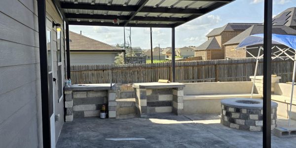 Masonry stamped concrete metal patio cover bench seating stucco and fire pit